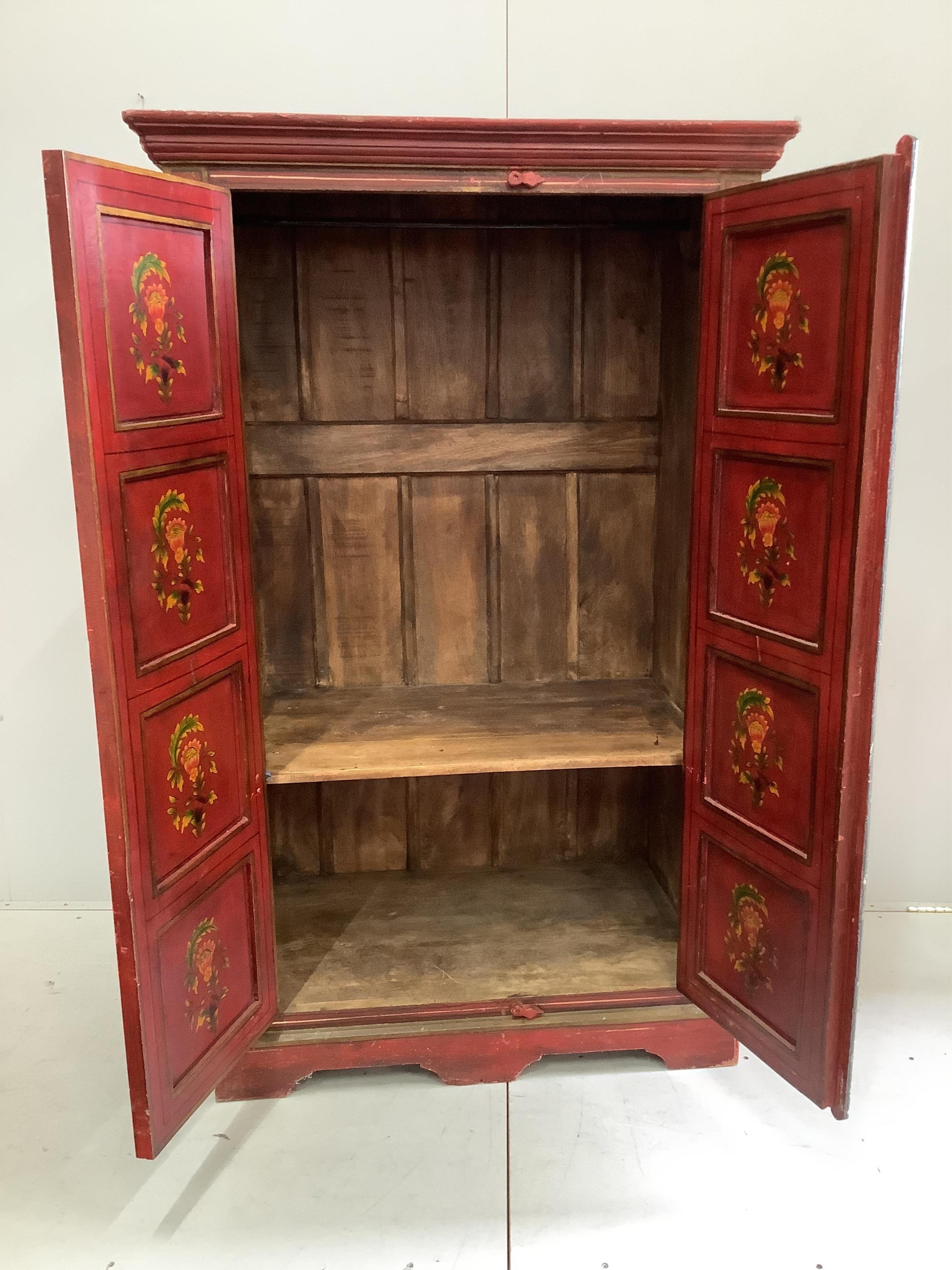 An Indian painted two door hall cupboard, width 100cm, depth 60cm, height 164cm. Condition - fair